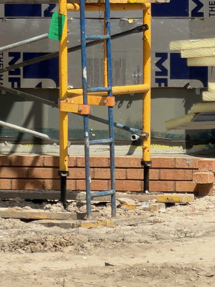 Construction workers have begun laying bricks