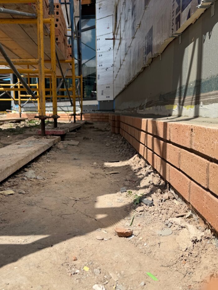Construction workers have begun laying bricks