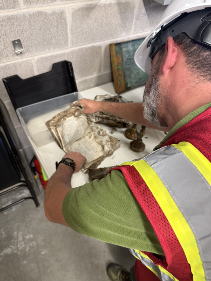 July 25 - Rabbi Hayon examining the contents