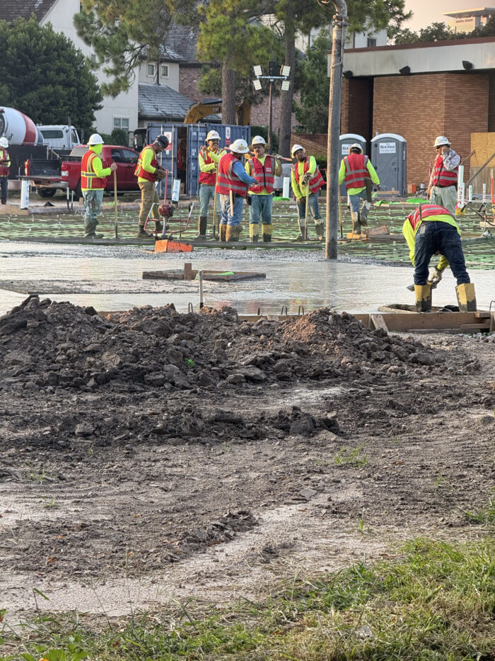 Construction crews pouring the foundation for the new building.