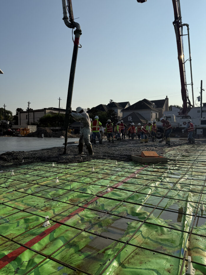 Construction crews pouring the foundation for the new building.