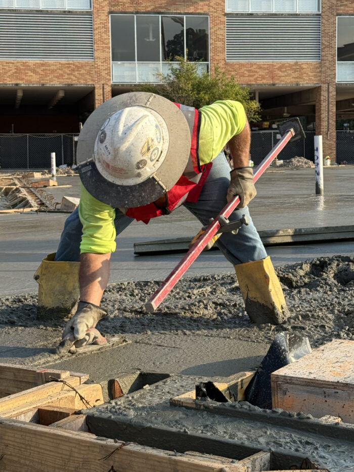 Construction crews pouring the foundation for the new building.