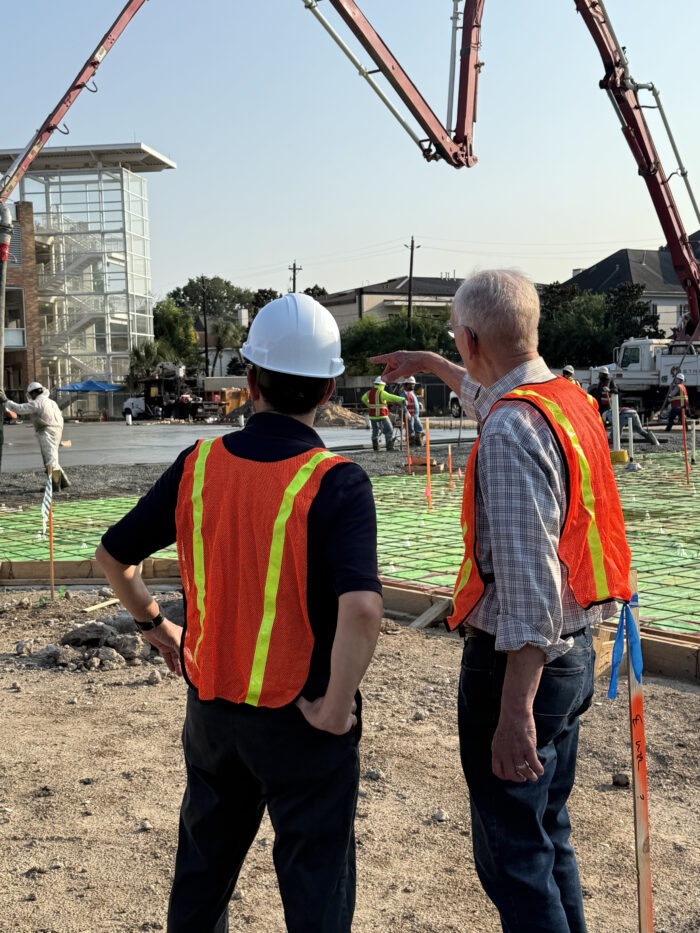 Rabbi Hayon and Building Committee Chair Matt Pasternak watch construction crews pouring concrete for the foundation