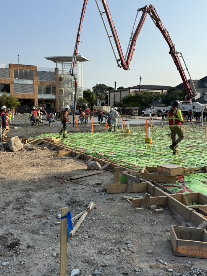 Construction crews pouring the foundation for the new building.